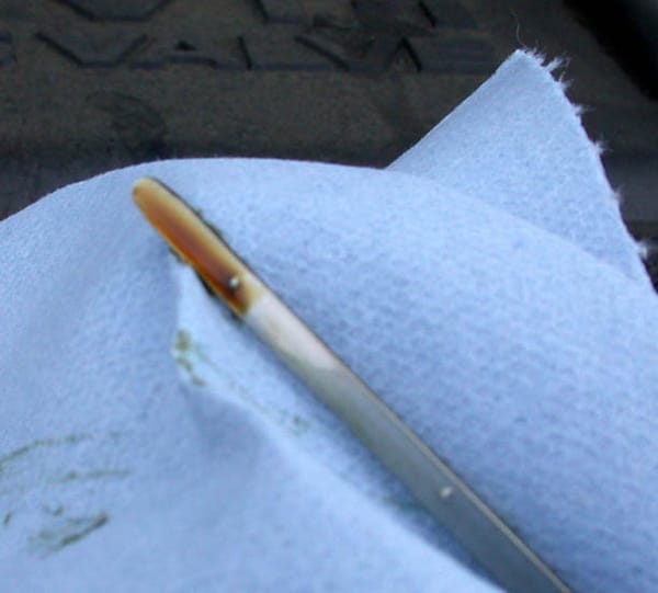 Is it possible to pull out the oil dipstick with the engine running in a BMW?